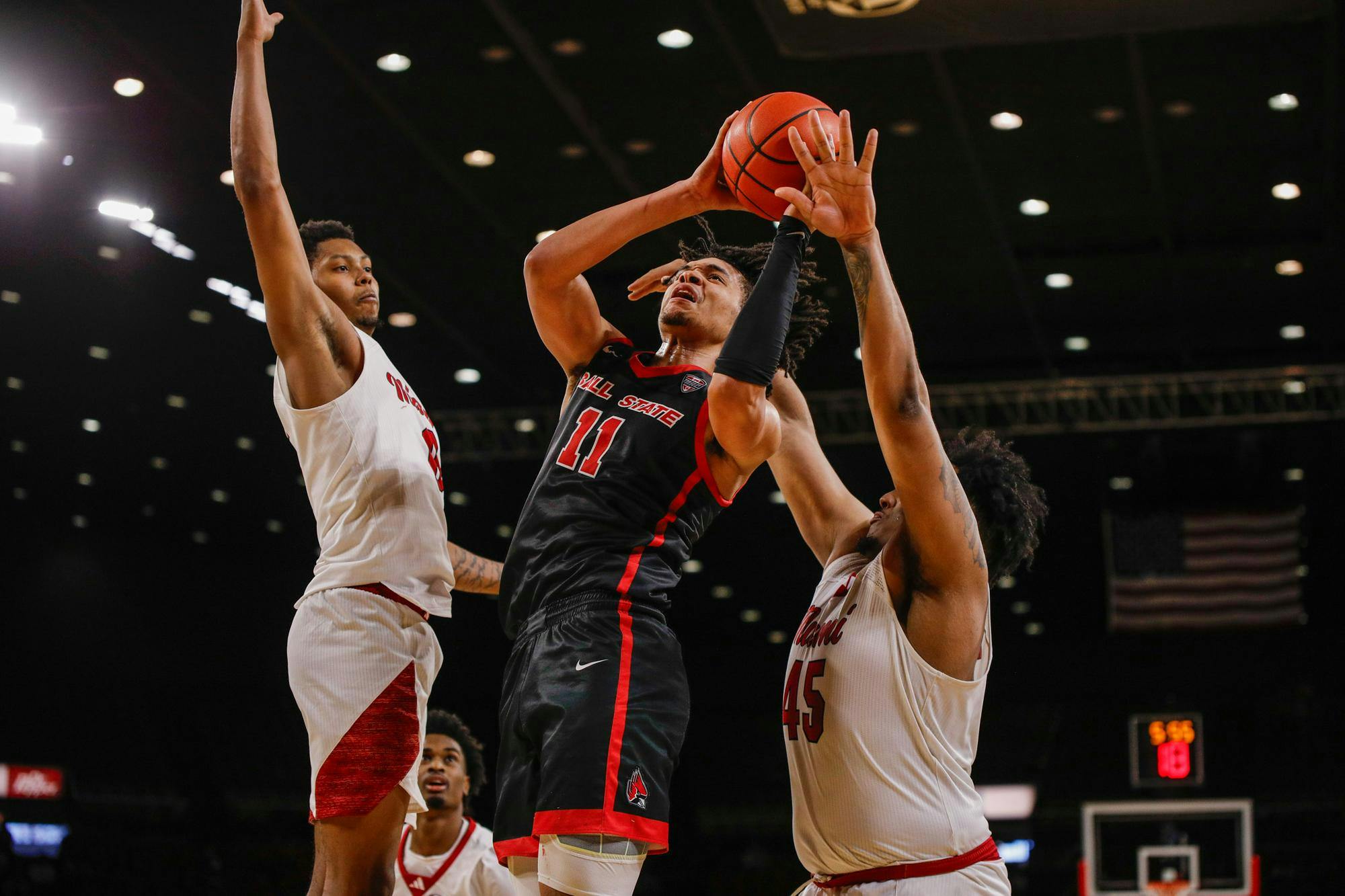 Junior forward Basheer Jihad puts the ball up for two against Miami Feb. 17 at Millet Hall. Jihad had 18 total points in the game. Andrew Berger, DN 