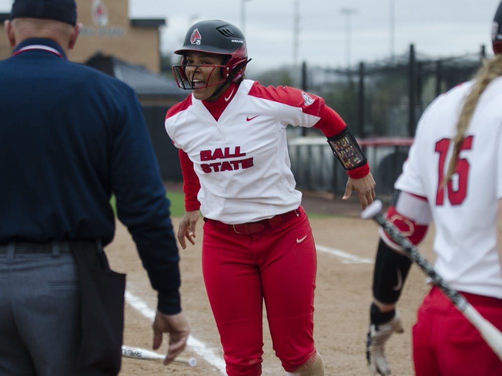 Freshman outfielder Kennedy Wynn walks off of the field after scoring during the second game of the double-header against Northern Illinois on April 4 at the Softball Field at the First Merchants Ballpark Complex. Ball State won the game 6-4. Emma Rogers // DN