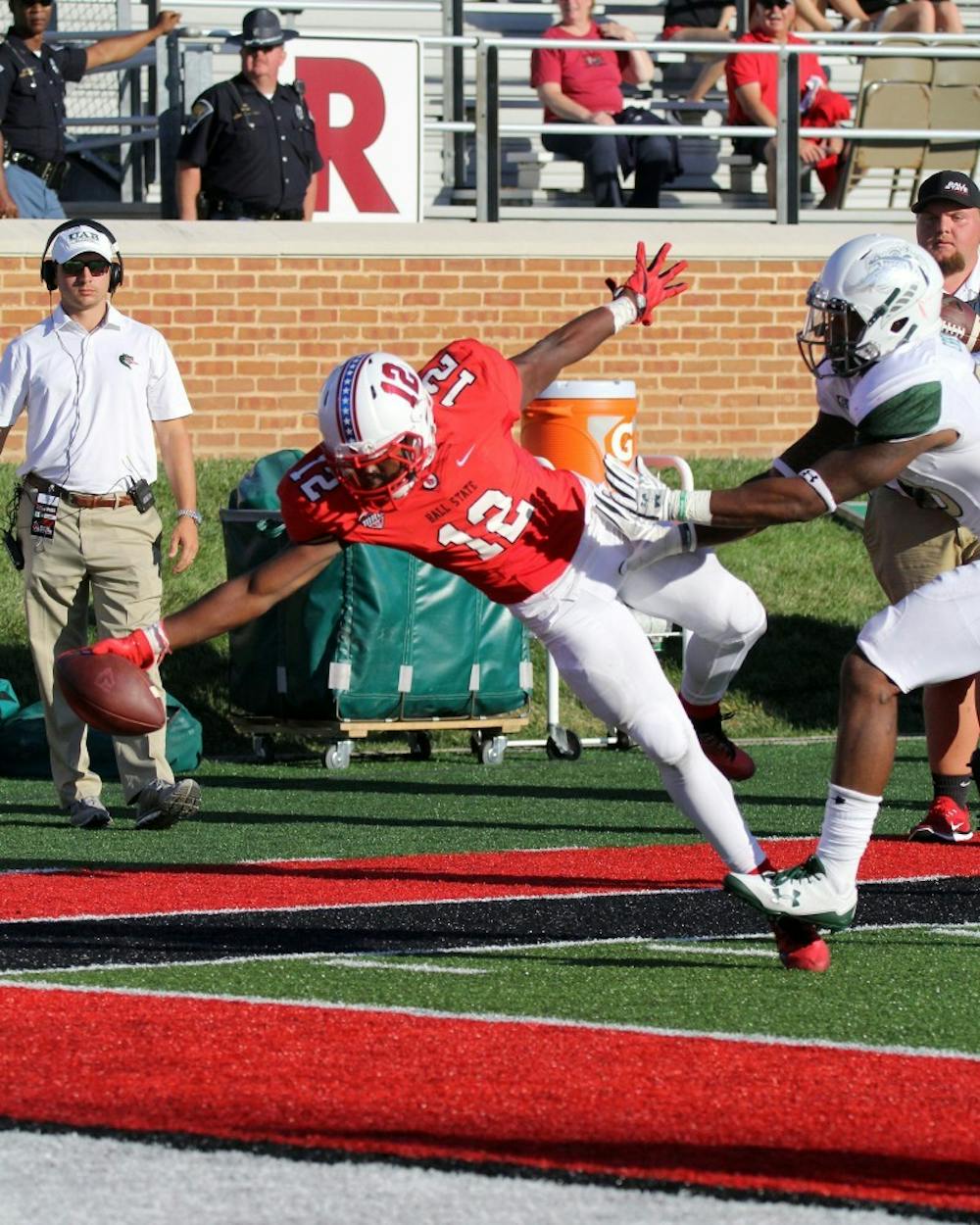 Ball State freshman wide receiver Justin Hall falls into the end zone with 8:26 remaining in the fourth quarter of the Cardinals’ game against UAB on Sept. 9 at Scheumann Stadium. Hall’s touchdown put Ball State up 51-24. Paige Grider, DN File