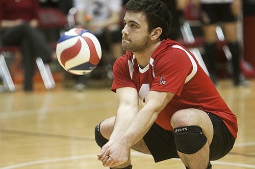 Tommy Rouse goes for a dig March 22 during the game against Ohio. The Cardinals swept the match, winning in three sets. DN PHOTO JORDAN HUFFER