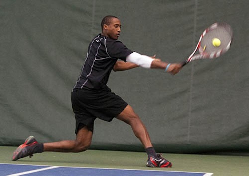 Senior Alexandre Brym stretches to return a volley during his singles match against Detroit Mercy on Jan. 25. Ball State lost to Indiana 6-1 on Feb. 3. DN FILE PHOTO BOBBY ELLIS