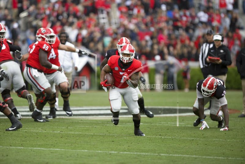 Georgia running back D'Andre Swift (7) runs the ball in the first half of the NCAA football spring G-Day game at the University of Georgia in Athens, Ga., on Saturday, April 20, 2019. (Jenn Finch/Athens Banner-Herald via AP)