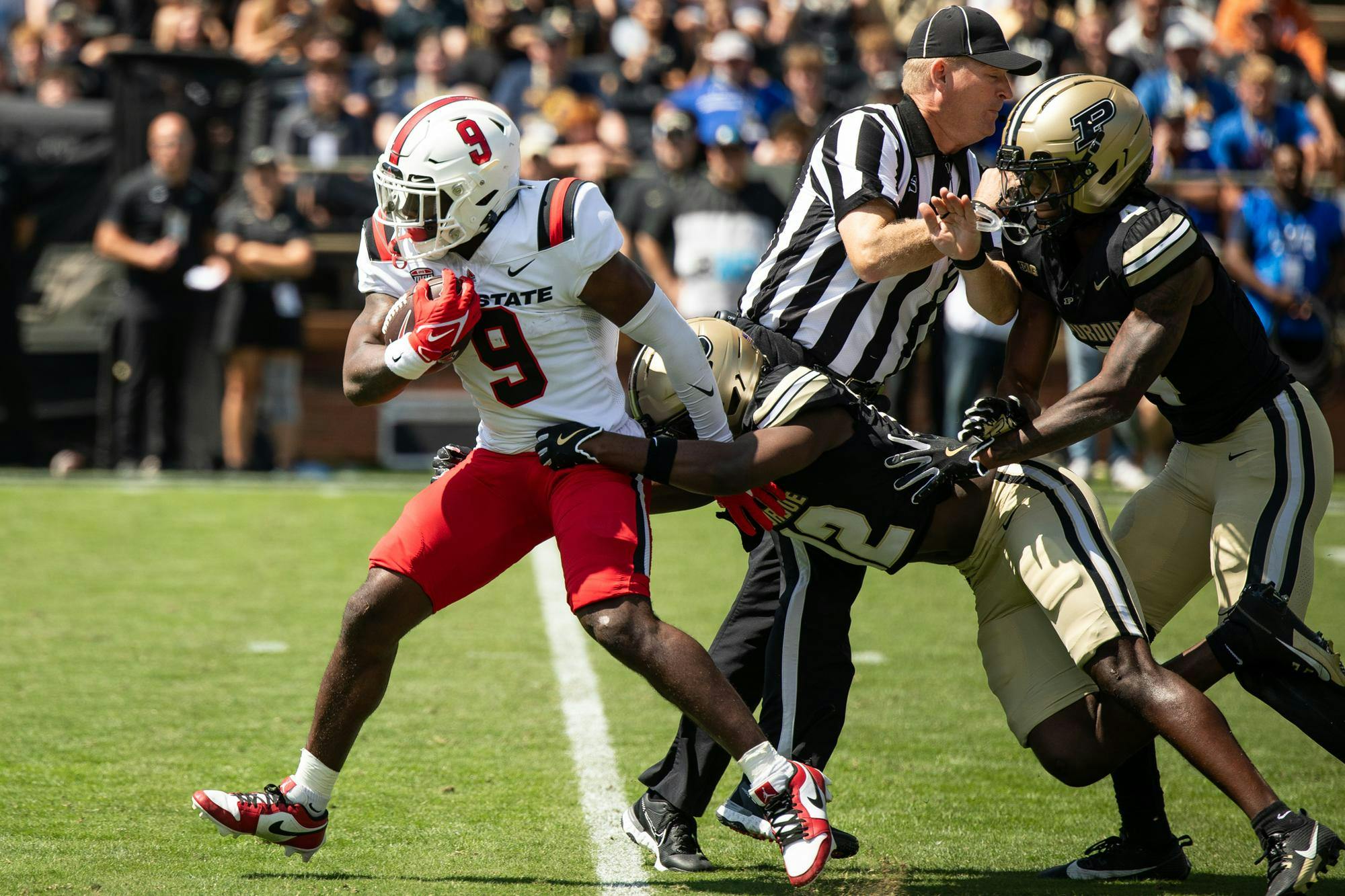 Ball State junior Qua Ashley runs the ball against Purdue Aug. 30 at Ross-Ade Stadium. Ashley's longest reception was two yards. Andrew Berger, DN 