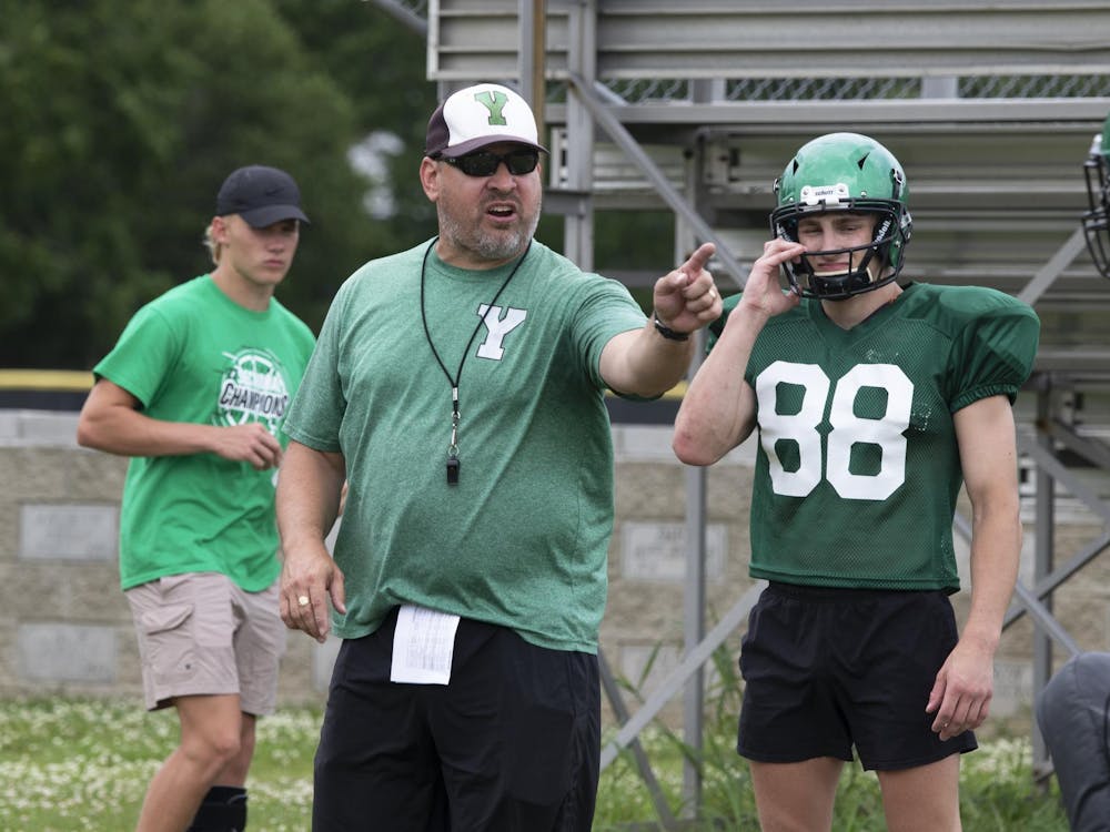 Yorktown head coach Mike Wilhelm points July 12 at a practice at Yorktown High School. Zach Carter, DN.