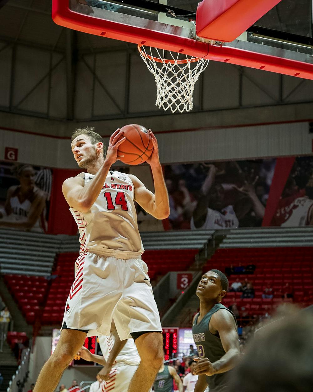<p>Senior forward, Kyle Mallers (14), grabs a rebound during the second half against the defense on Nov. 5, 2019, at John E. Worthen Arena. Mallers ended the game with seven total rebounds for the Cardinals win 87-43. <strong>Omari Smith, DN</strong></p>