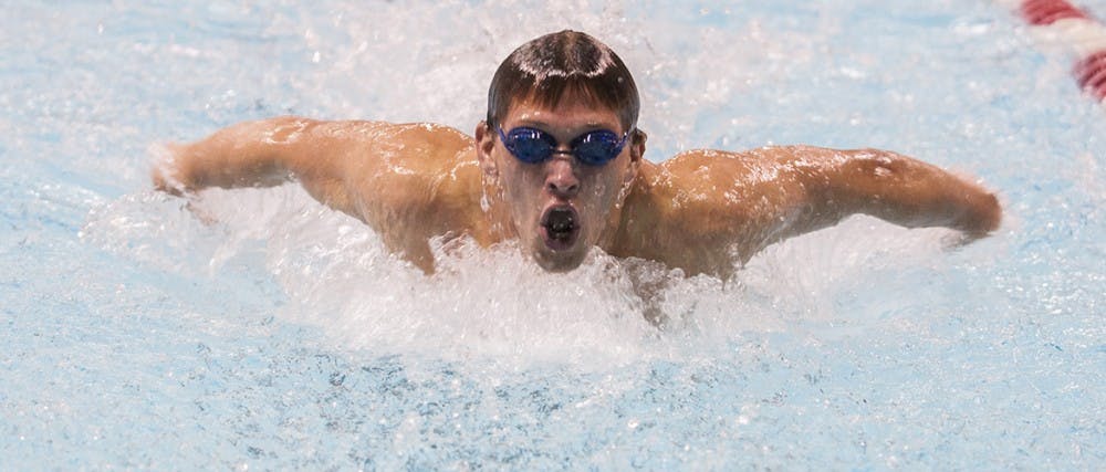 Freshman Nick Rodriguez swims in the 100-yard butterfly during the Red-White Meet on Oct. 25. DN PHOTO JONATHAN MIKSANEK
