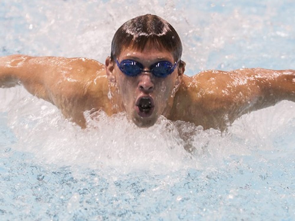 Freshman Nick Rodriguez swims in the 100-yard butterfly during the Red-White Meet on Oct. 25. DN PHOTO JONATHAN MIKSANEK