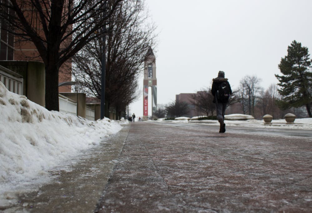 Students had a more difficult walk to classes on Monday, Jan. 8, 2017. After freezing rain late Sunday, campus sidewalks and streets were slick and icy. Kaiti Sullivan, DN Photo