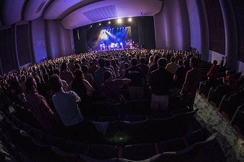 Audience members stand up and dance during the Here Come the Mummies show on Sept. 28  at Emens Auditorium. DN PHOTO JONATHAN MIKSANEK