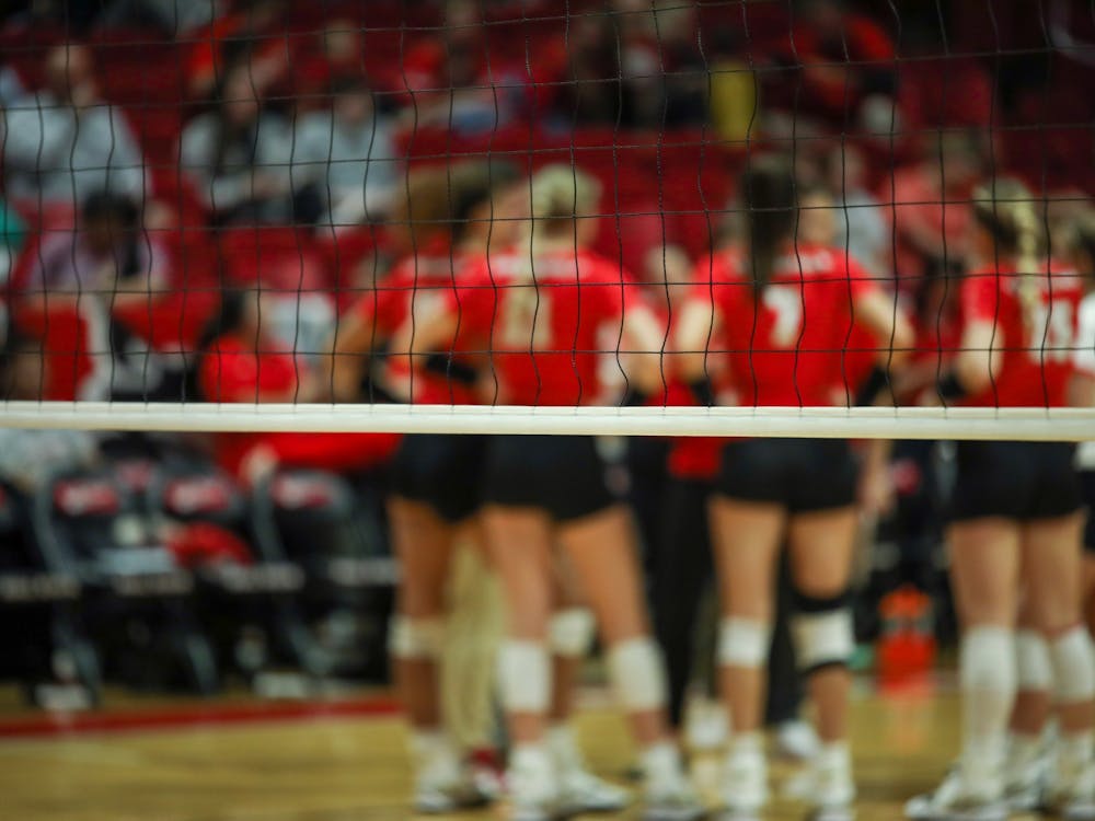 The Ball State women’s volleyball team is huddles together after receiving a kill in the second set from their opponent Eastern Michigan on Sep. 30 at Worthen Arena in Muncie, Indiana. Eve Green, DN