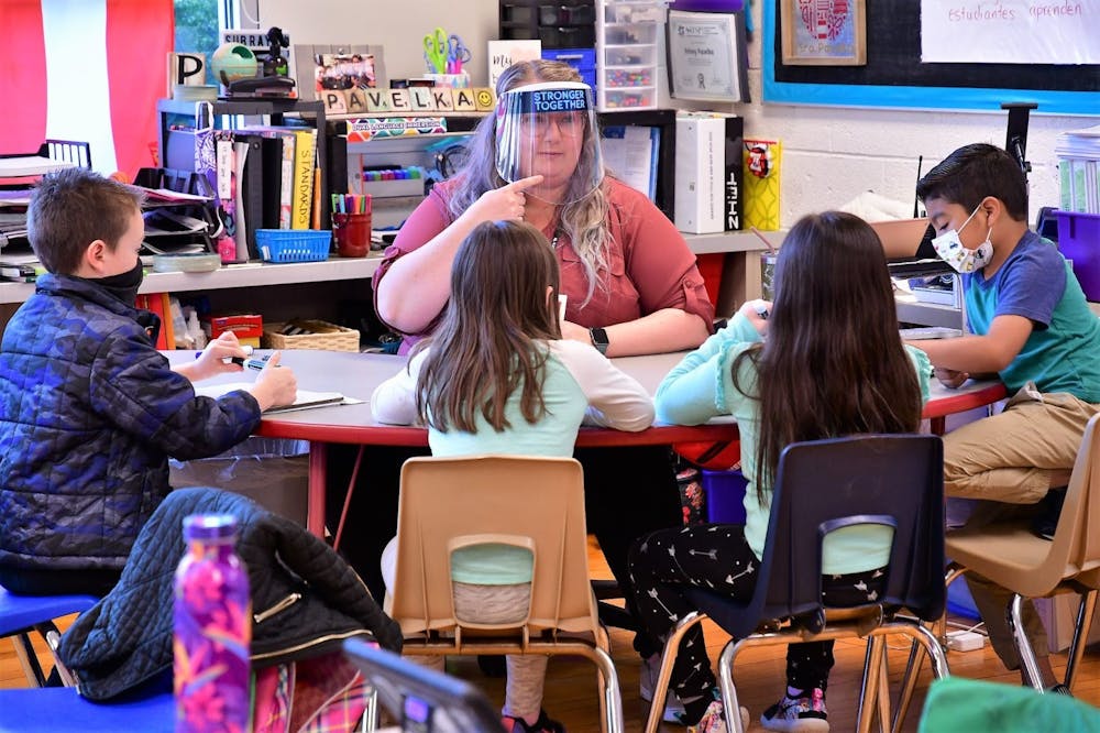 <p>Kelsey Pavelka reads with students in her class April 16, 2021, in West View Elementary School. Pavelka is a teacher in the Dual Language Immersion Program, which teaches students Spanish and English simultaneously to foster early language development. <strong>Andy Klotz, Photo Provided</strong></p>
