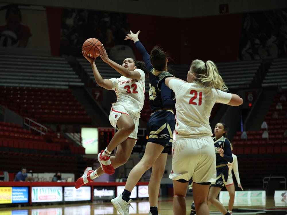 Cardinals senior forward Oshlynn Brown jumps to the rim Feb. 6, 2021, at John E. Worthen Arena. The Cardinals lost 89-84 to the Zips. Jacob Musselman, DN 