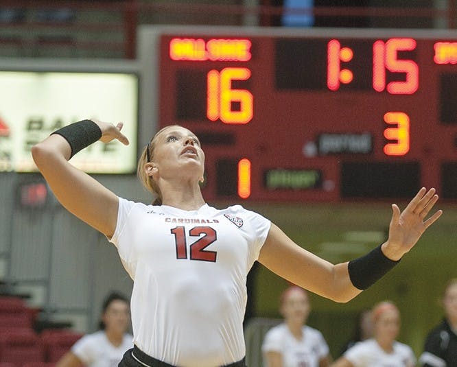 Sophomore Setter Jenna Spadafora serves the ball during the game wednesday. DN PHOTO JORDAN HUFFER 