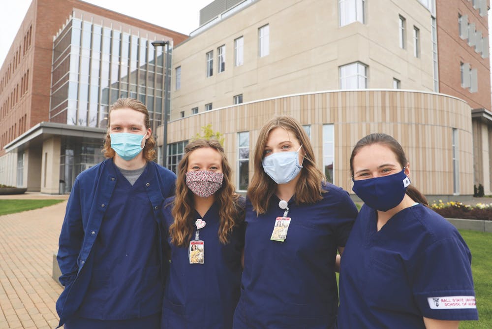 <p>(from left to right) Senior nursing majors Gabriel Cochard, Lauren Hamil, Emily Bastian and Kaitlyn Hansen pose for a photo outside of the Health Professions Building. The building opened in 2019 and houses the university&#x27;s College of Health. <strong>Rylan Capper, DN</strong></p>