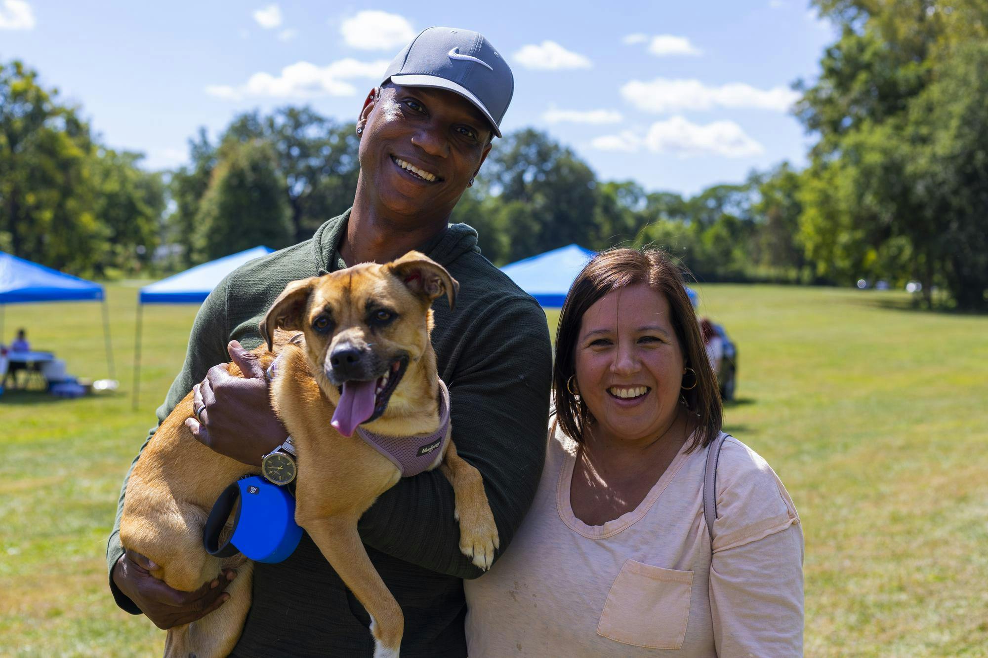 Dog owners Kareem and Amanda pose with their dog Coco on Sept. 7 in Yorktown Ind. The showcase included pet related vendors, a dog food giveaway and a 5k fun run. Brenden Rowan, DN