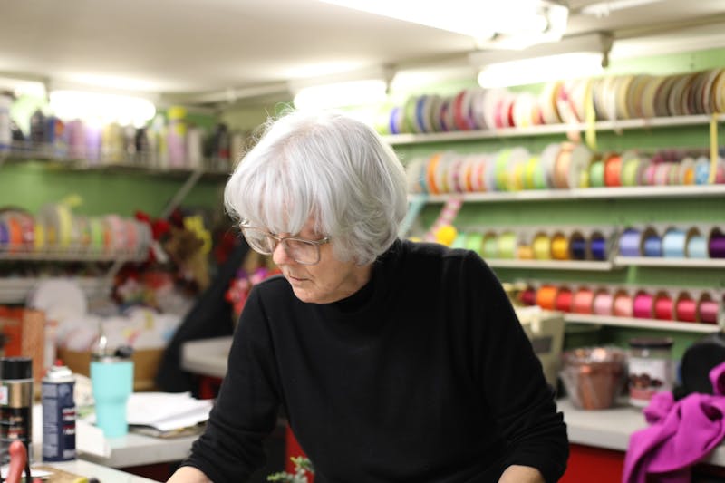 Judy Benken works on an arrangement Jan. 28, 2020, at Normandy Flowers. Benken is a third-generation florist that has been at Normandy Flower Shop since 1982. Pauleina Brunnemer, DN