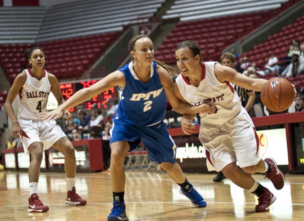 Junior guard Brandy Woody pushes past IPFW’s Rachel Mauk to the paint on Nov. 19. Ball State went 1-1 over the weekend with a win against Bethune Cookman and a loss against Stetson.  DN FILE PHOTO JONATHAN MIKSANEK