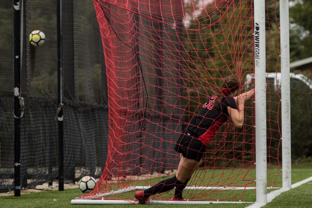 Midfielder/forward Tatiana Mason grabs the goal to stop herself from running through it after missing a goal Oct. 14, 2018, at Briner Sports Complex. Ball State showed up to work in the second half of their game against the University at Buffalo, but couldn’t make a goal to expand their lead ending with a 1-0 victory. Eric Pritchett,DN