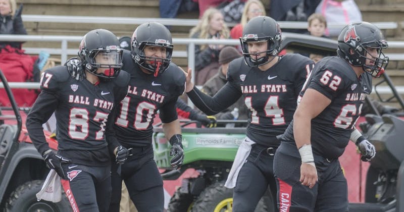 Members of the Ball State football team celebrate after freshman wide receiver Corey Lacanaria scored a touchdown during the game against Eastern Michigan on Nov. 22 at Scheumann Stadium. DN PHOTO BREANNA DAUGHERTY