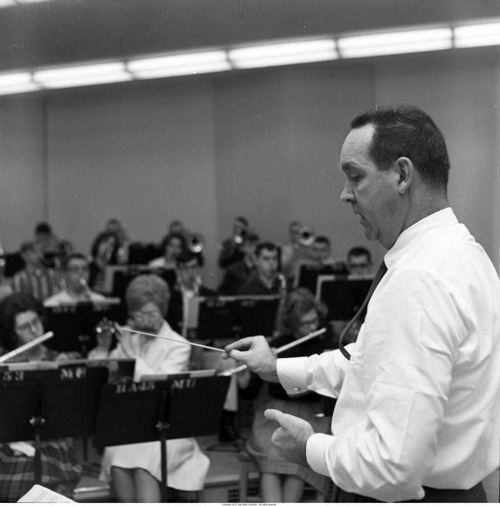 Former Director of Bands, Earl Dunn practices with his marching band for the 1965 inaugural parade. PHOTO COURTESY OF BALL STATE UNIVERSITY ARCHIVES AND SPECIAL COLLECTIONS