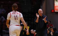 Ball State women's basketball coach Brady Sallee claps and smiles at senior Lachelle Austin while facing IU Indianapolis Nov. 8 at Worthen Arena. Austin had four steals in the game. Andrew Berger, DN 