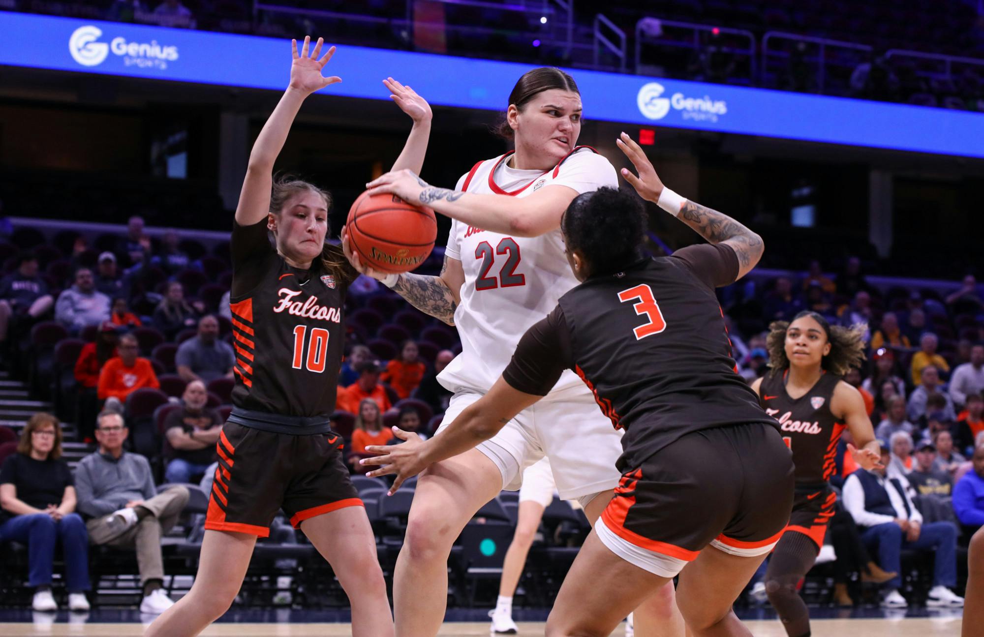 Ball State senior Tessa Towers fights to keep the ball away from two defenders March 11 at Rocket Arena. Towers has a season high of 13 rebounds. Adam Jones, DN