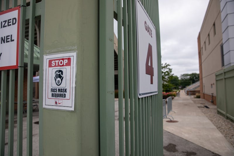 A sign reminds people entering to wear face masks Sept. 1, 2020, outside of Scheumann Stadium. All spring 2021 commencement ceremonies will be held outdoors at Scheumann Stadium in May 2021. Jacob Musselman, DN File