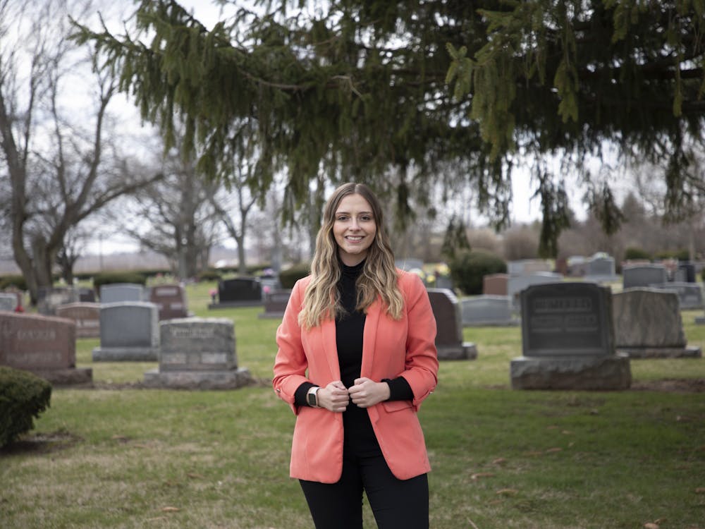 Funeral Director and embalmer Molly Haaff poses for a photo in the Elm Ridge Funeral Home and Memorial Park cemetery on March 28 in Muncie, Ind. Haaff has been working with Elm Ridge for three years. Mya Cataline, DN