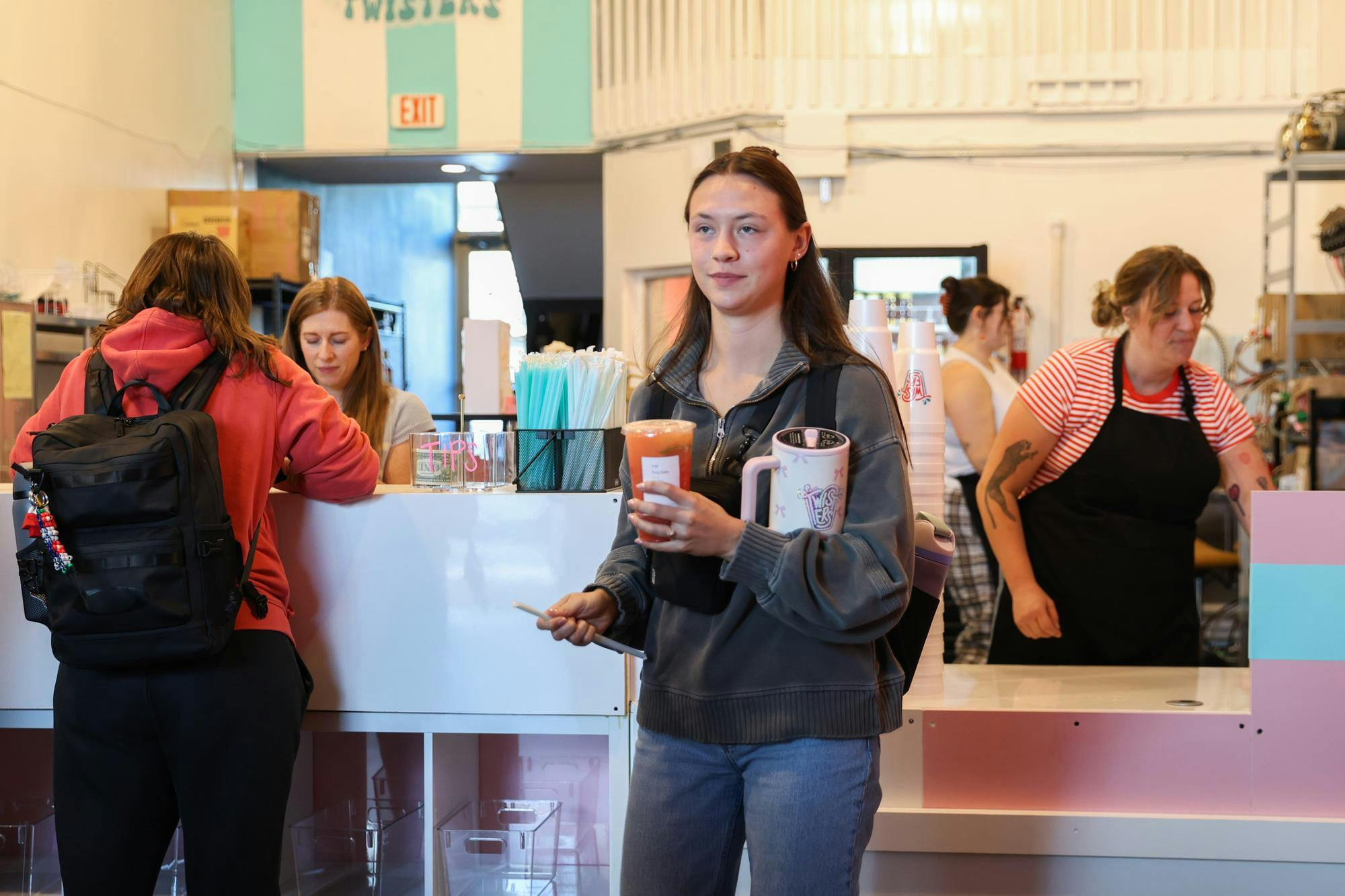 A patron of Twisters Soda bar walks out with a beverage Oct. 10 in The Village. Twisters had it's grand opening to the Ball State Campus. Andrew Berger, DN 
