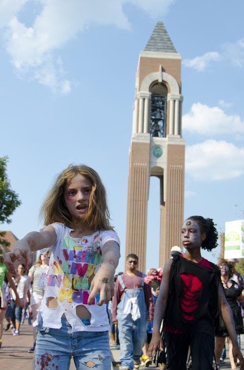 Willoe Cunnington walks with roughly 250 other zombies in a benefit walk for charity. DN FILE PHOTO COREY OHLENKAMP