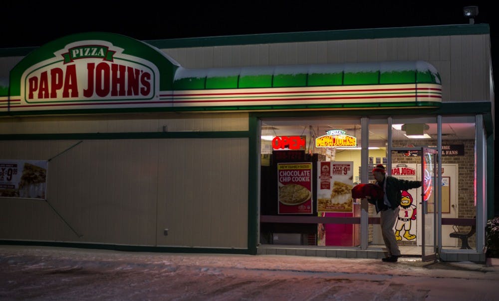 The snowy weather on Feb. 14, as well as it being Valentine’s Day, made a busy day for Papa John’s and its deliverymen. The deliverymen said the Muncie roads take a while to be plowed, so slowing down is necessary. DN PHOTO BREANNA DAUGHERTY