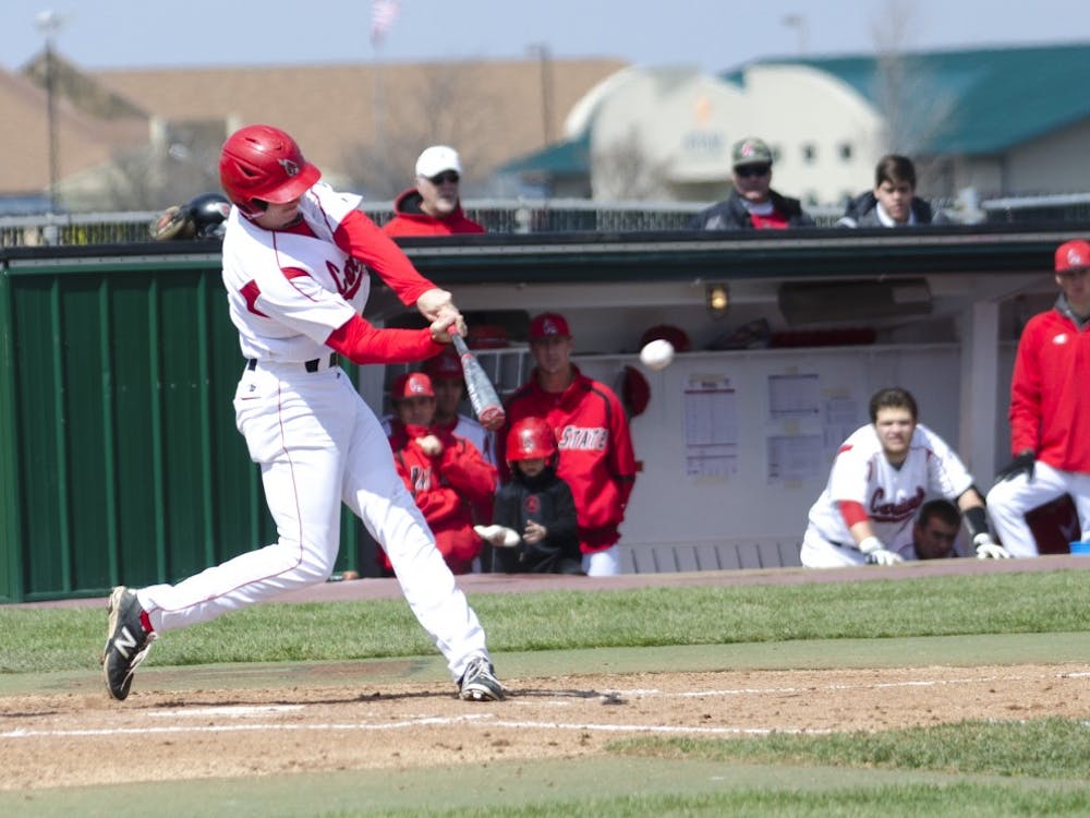 Senior outfielder Sean Godfrey hits the ball in the game against Eastern Michigan on April 5 at Ball Diamond. Godfrey had four hits. DN PHOTO BREANNA DAUGHERTY 