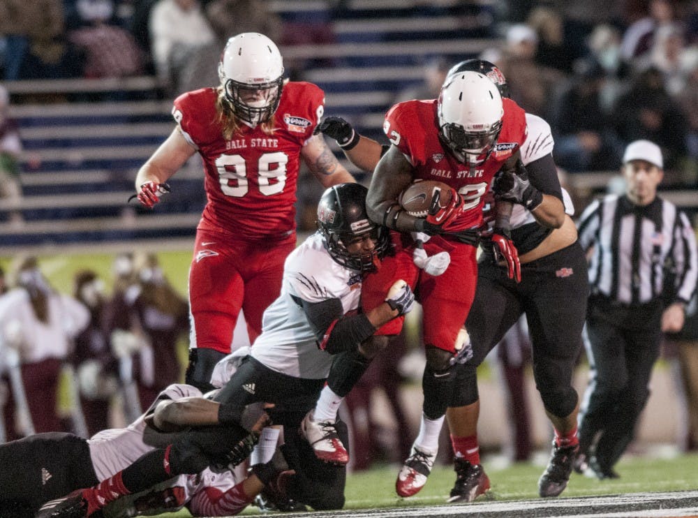 Junior running back Jahwan Edwards attempts to shake an Arkansas State defender Jan. 5 during the GoDaddy Bowl in Mobile, Ala. DN PHOTO JONATHAN MIKSANEK