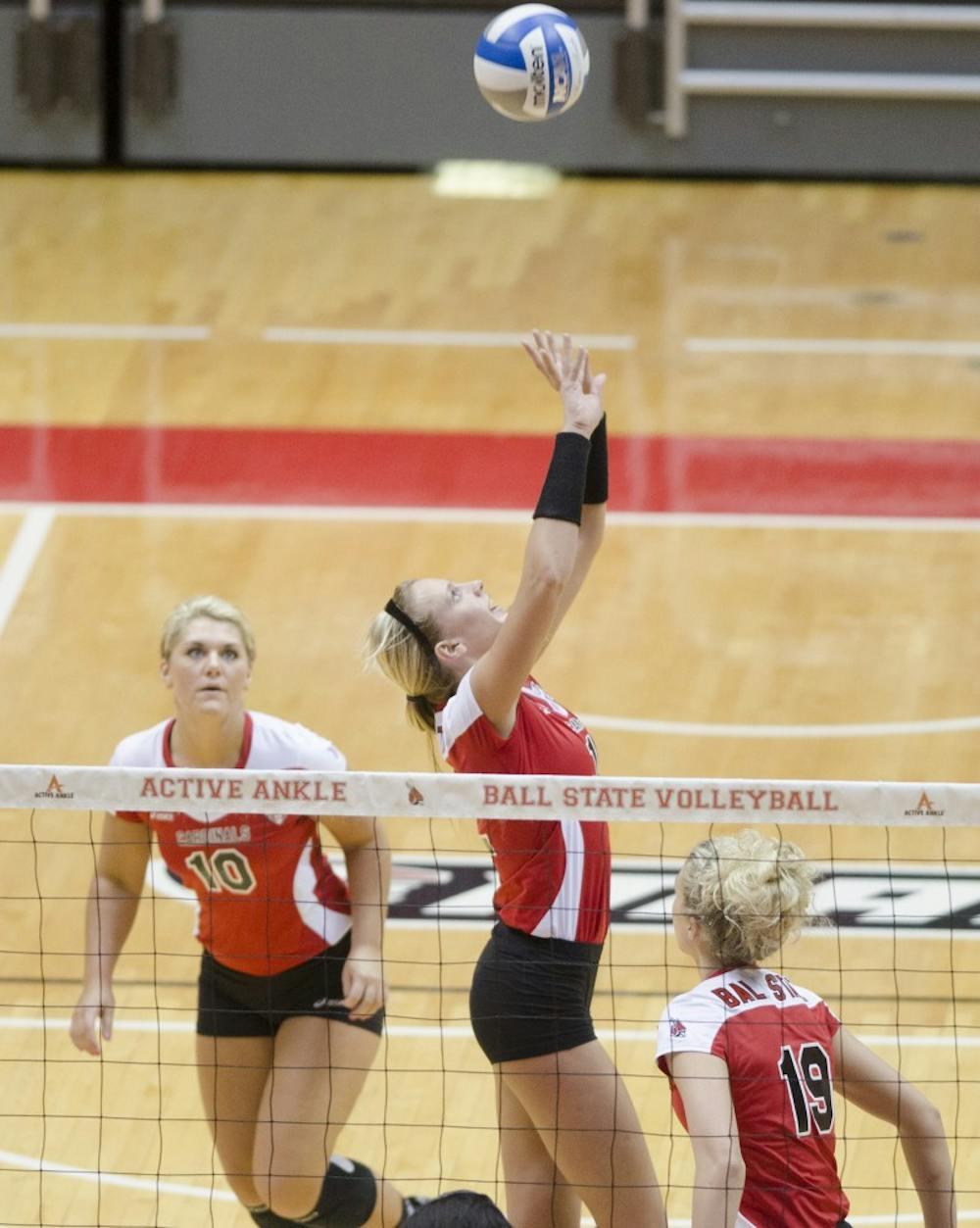 Junior setter Jenna Spadafora sets the ball in the second set of the scrimmage against Purdue University on March 29 at Worthen Arena. DN PHOTO BREANNA DAUGHERTY 