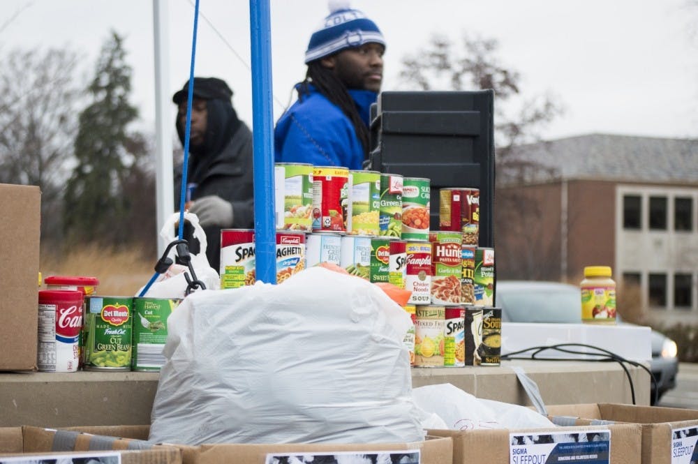 <p>Members of Phi Beta Sigma stood at the Scramble Light for 24 hours&nbsp;from Monday at 8am through the night to Tuesday morning, collecting donations and&nbsp;raising&nbsp;awareness for the homeless.<em> Alaina Jaye Halsey // DN File&nbsp;</em></p>