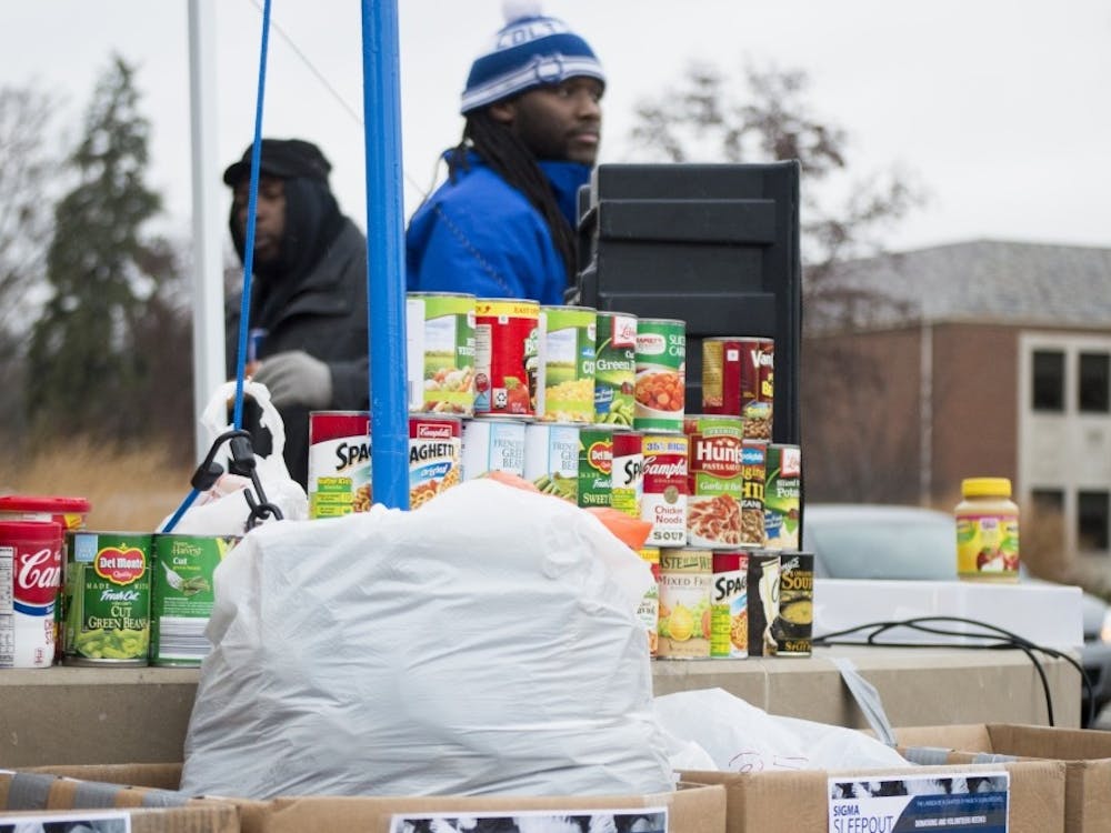 Members of Phi Beta Sigma stood at the Scramble Light for 24 hours&nbsp;from Monday at 8am through the night to Tuesday morning, collecting donations and&nbsp;raising&nbsp;awareness for the homeless. Alaina Jaye Halsey // DN File&nbsp;