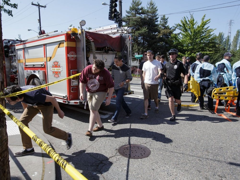 Seattle Pacific University students are led out of the crime scene after a shooting on campus on Thursday, June 5, 2014. Officials say there are multiple victims, but no fatalities and a suspect is in custody. (Dean Rutz/Seattle Times/MCT)