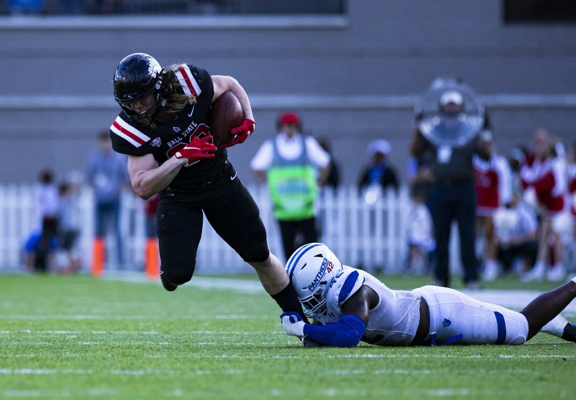 Freshman running back Carson Steele (33) escapes a Georgia State defender in the 2021 TaxAct Camellia Bowl at the Cramton Bowl in Montgomery, Ala. Dec. 25. Steele had 40 receiving yards for the Cardinals. Jacy Bradley, DN