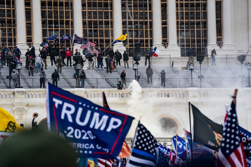 Supporters of US President Donald Trump clash with the US Capitol police during a riot at the US Capitol on Jan. 6, 2021, in Washington, DC. Donald Trump's supporters stormed a session of Congress held January 6 to certify Joe Biden's election win, triggering unprecedented chaos and violence at the heart of American democracy and accusations the president was attempting a coup. (Alex Edelman/AFP/Getty Images/TNS)