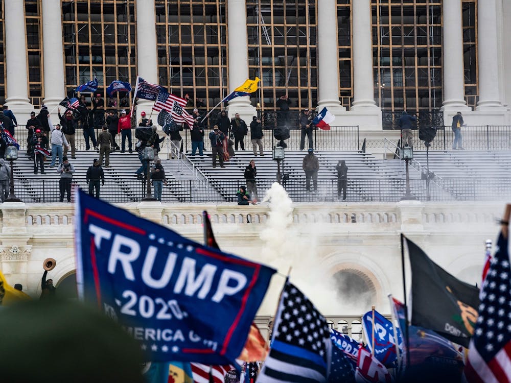 Supporters of US President Donald Trump clash with the US Capitol police during a riot at the US Capitol on Jan. 6, 2021, in Washington, DC. Donald Trump's supporters stormed a session of Congress held January 6 to certify Joe Biden's election win, triggering unprecedented chaos and violence at the heart of American democracy and accusations the president was attempting a coup. (Alex Edelman/AFP/Getty Images/TNS)
