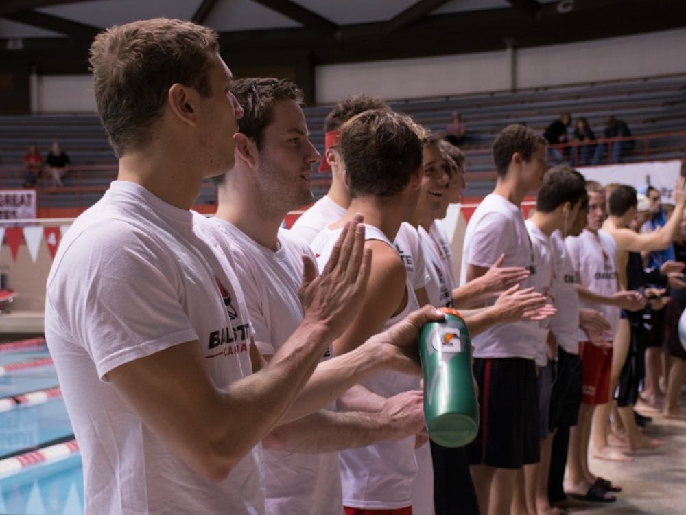 The Ball State men's swim team claps during their introduction at the Red and White Meet in the Lewellen Pool on Oct. 15, 2016.  The white team won 100-96. Kaiti Sullivan // DN