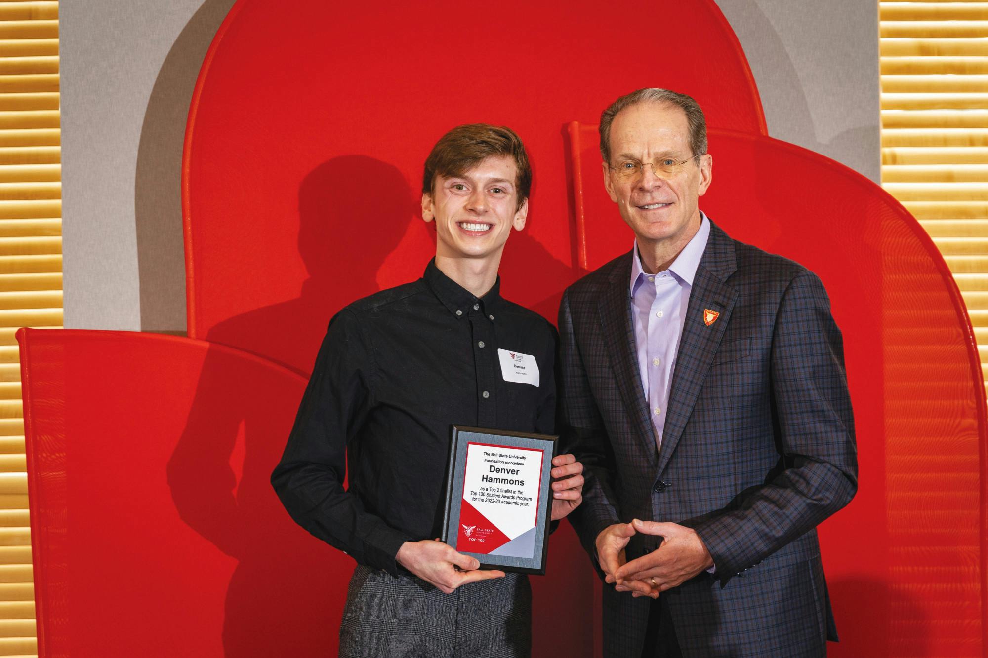 Top 100 student Denver Hammons (left) poses with Ball State University President Geoffrey Mearns (right) at the Top 50 brunch March 25 at the Alumni Center in Muncie, Ind. Samantha Blankenship, Photo Provided