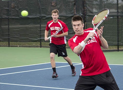 Senior Cliff Morrison returns the Northern Illinois volley on April 6 as senior Dalton Albertin looks on. Morrison and Albertin defeated their Northern Illinois opponents 8-6. DN FILE PHOTO ANDREW KELLY