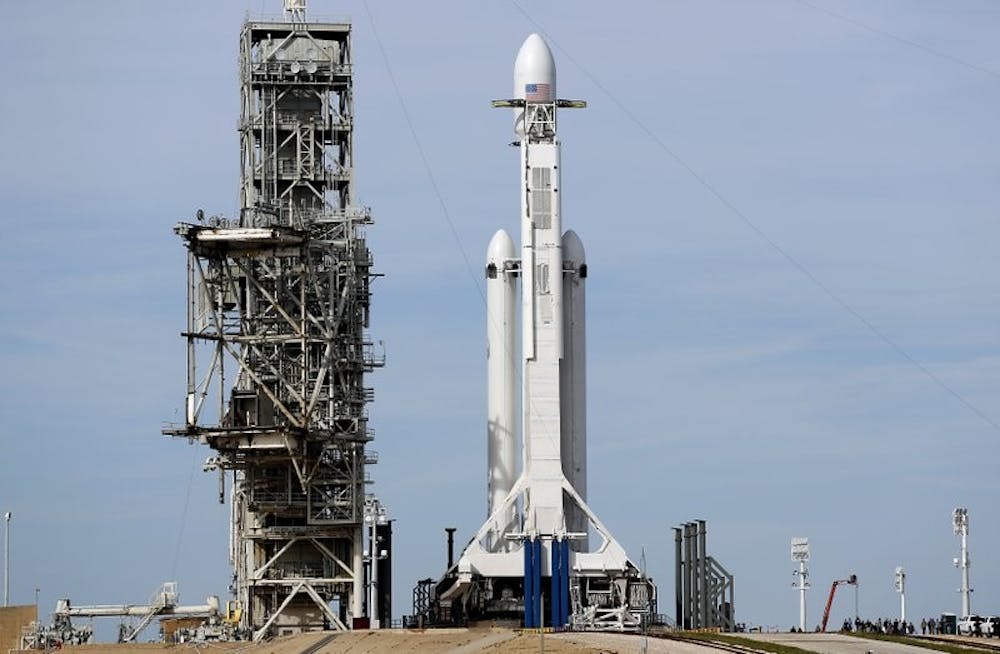 <p>A Falcon 9 SpaceX heavy rocket stands ready for launch on pad 39A at the Kennedy Space Center in Cape Canaveral, Fla., Monday, Feb. 5, 2018. The Falcon Heavy scheduled to launch Tuesday afternoon, has three first-stage boosters, strapped together with 27 engines in all. <strong>Terry Renna, AP Photo</strong></p>