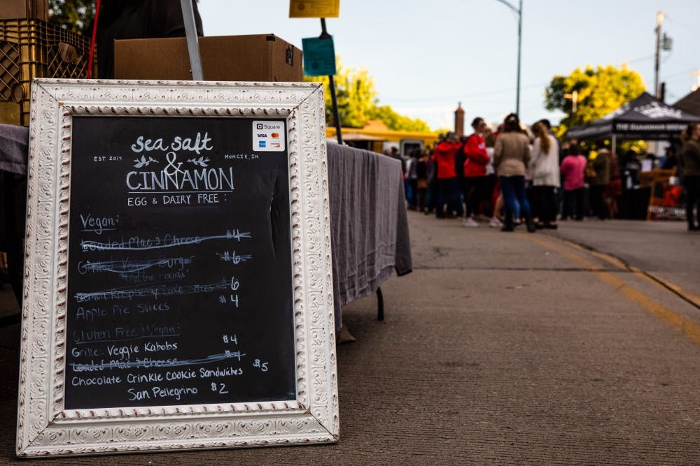 Muncie community members gathered to share in laughter, food and activities Thursday on the Washington Street Bridge for Muncie’s Bridge Dinner.
Multiple parts of the community were represented at the events from the presence of local food and item vendors such as the Guardian Brewing Company and the Muncie Central Jazz Band to decorations created by second grade classes from Burris Laboratory School.
Erin Moore, program manager with the Office of Community Engagement at Ball State, said this biannual event hosted by Muncie Neighborhoods was sparked by Peter Kageyama’s “Love Where You Live” campaign, which cultivating community pride for each facet of their hometown.