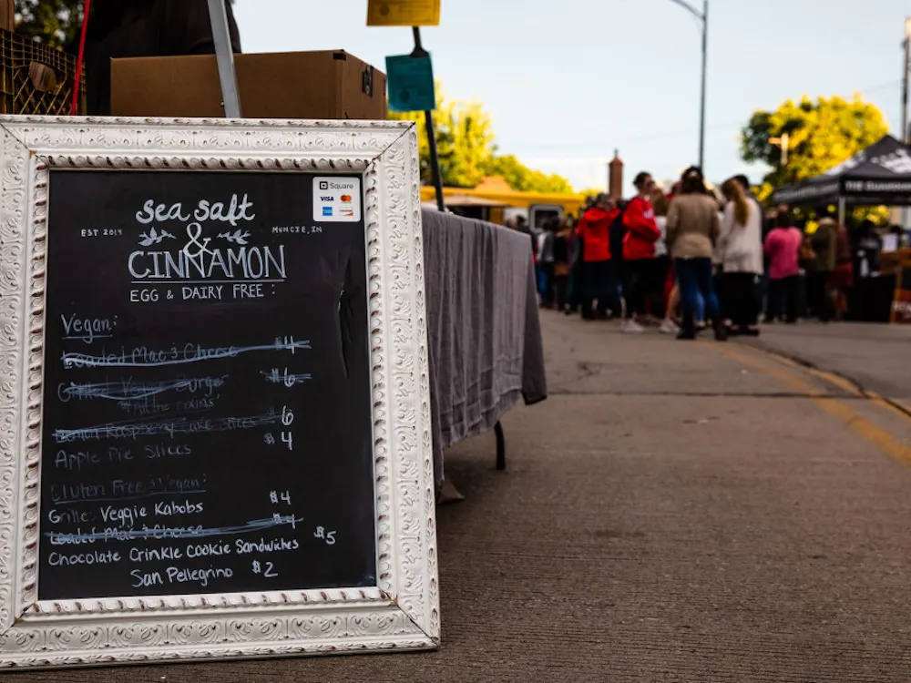 Muncie community members gathered to share in laughter, food and activities Thursday on the Washington Street Bridge for Muncie’s Bridge Dinner.
Multiple parts of the community were represented at the events from the presence of local food and item vendors such as the Guardian Brewing Company and the Muncie Central Jazz Band to decorations created by second grade classes from Burris Laboratory School.
Erin Moore, program manager with the Office of Community Engagement at Ball State, said this biannual event hosted by Muncie Neighborhoods was sparked by Peter Kageyama’s “Love Where You Live” campaign, which cultivating community pride for each facet of their hometown.