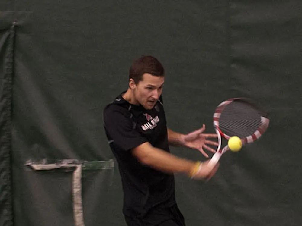 Senior Dalton Albertin returns a volley during his singles match against Detroit Mercy on Jan. 25. The men’s tennis team is headed into the postseason ranked first in the MAC. DN FILE PHOTO BOBBY ELLIS