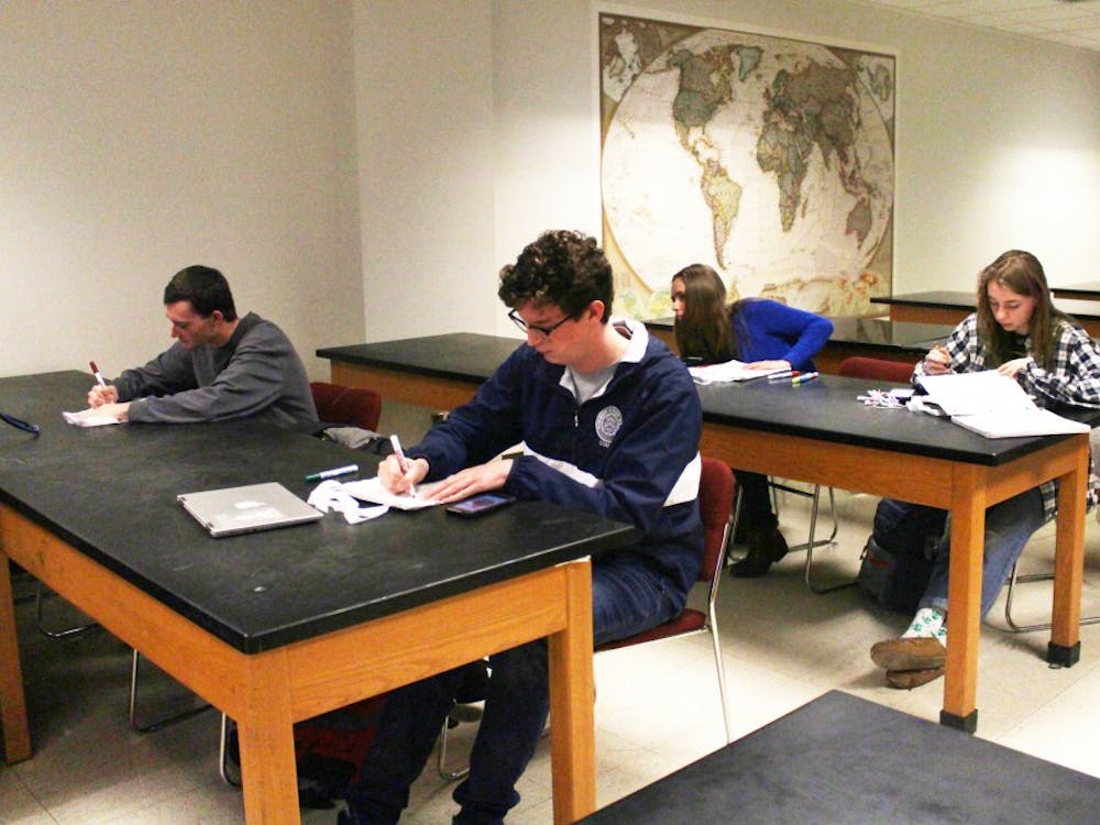 Members of Natural Resources and Environmental Management club decorate reusable bags Feb. 13, 2019, in the West Quad Building. The club meets once a week and participates in community service. Demi Lawrence, DN