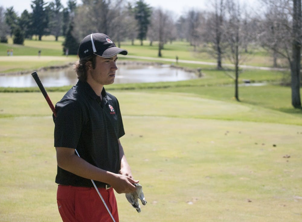 Sophomore golfer Johnny Watts gets ready to tee off on the par-3 16th hole at Delaware Country Club in the Earl Yestingsmeier Invitational. Watts finished the tournament in a three-way tie for the second place while the Cardinals won the team title. DN PHOTO COLIN GRYLLS