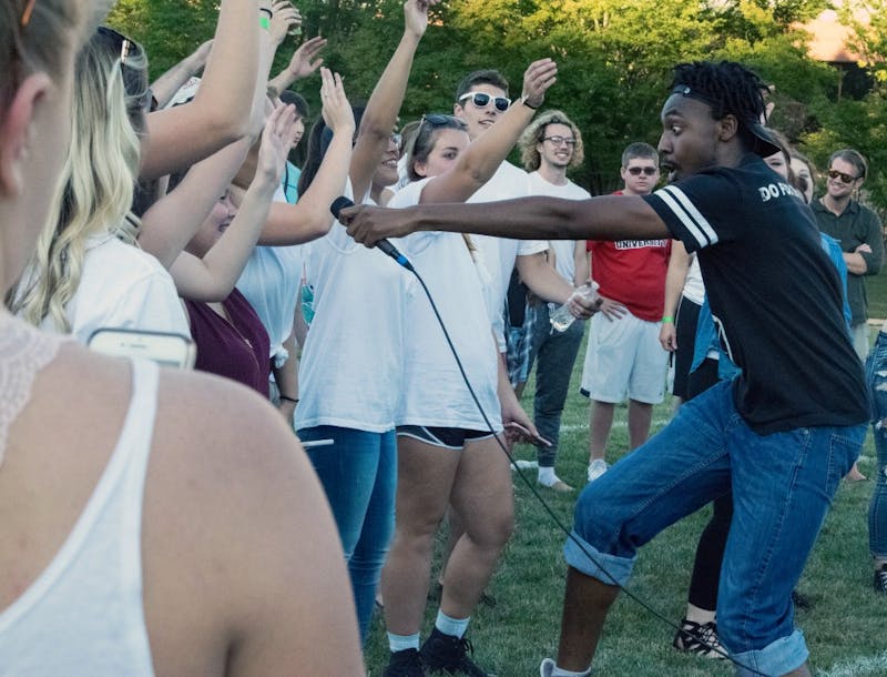 Rapper LJ III encourages his audience to chant some of his lyrics during Bonnamu on Sept. 15 at LaFollette Field. The winner of the battle wond a free recording session. Rachel Ellis, DN